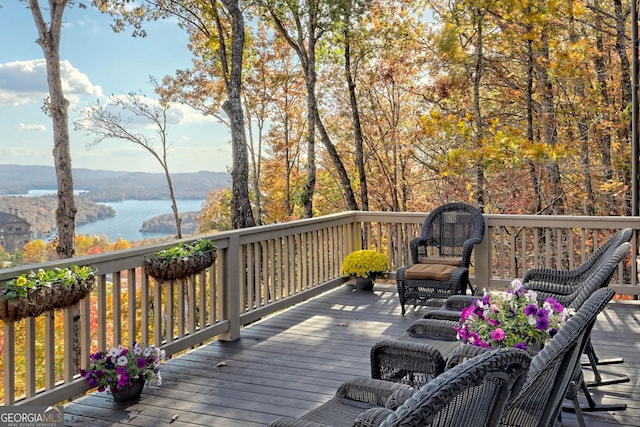 deck featuring a water and mountain view