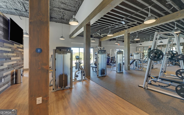 gym with a towering ceiling