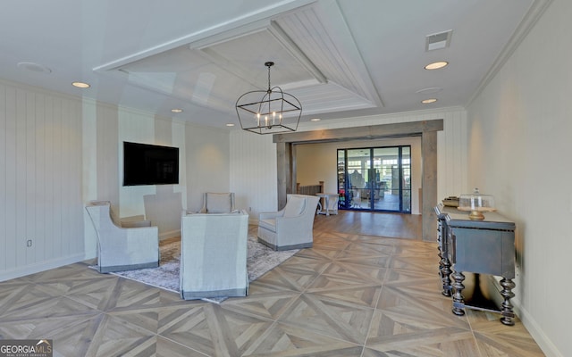 living room featuring crown molding, an inviting chandelier, and light parquet floors