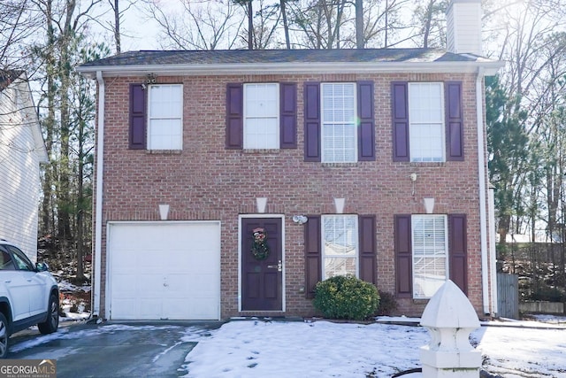 colonial home featuring a garage