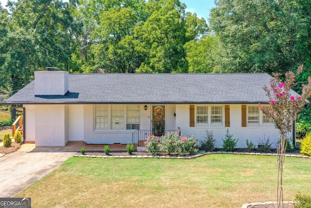 ranch-style house with a front lawn