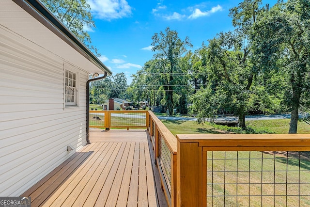 deck featuring a yard