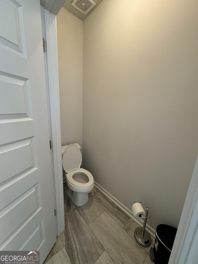 bathroom featuring toilet