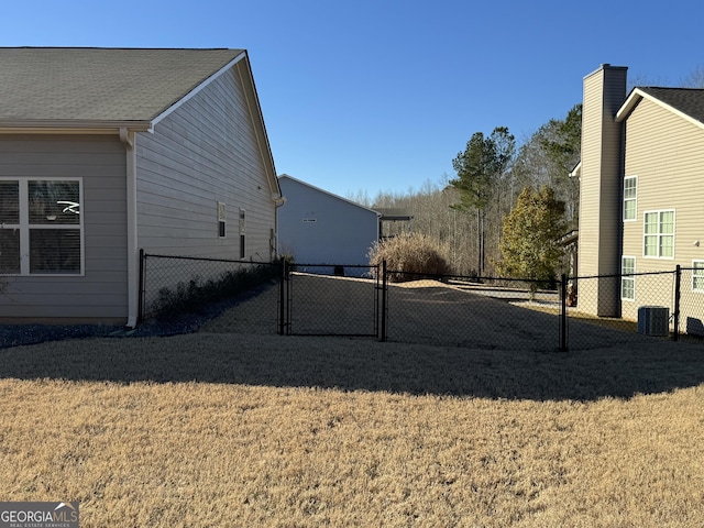 view of side of home featuring a yard