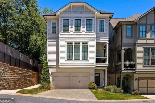 view of front of home with concrete driveway and an attached garage