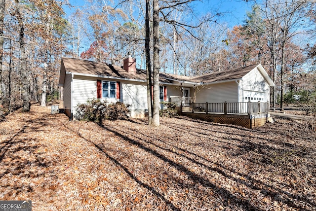 back of house with a garage