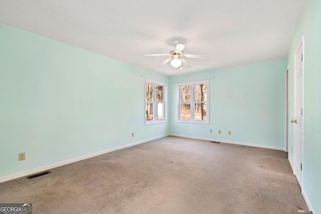 unfurnished room with carpet floors and ceiling fan