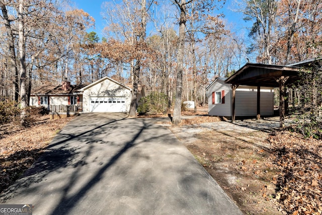 exterior space featuring a carport and a garage