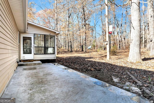 view of patio / terrace featuring a sunroom