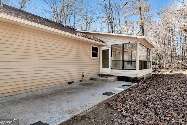 entrance to property featuring a patio area