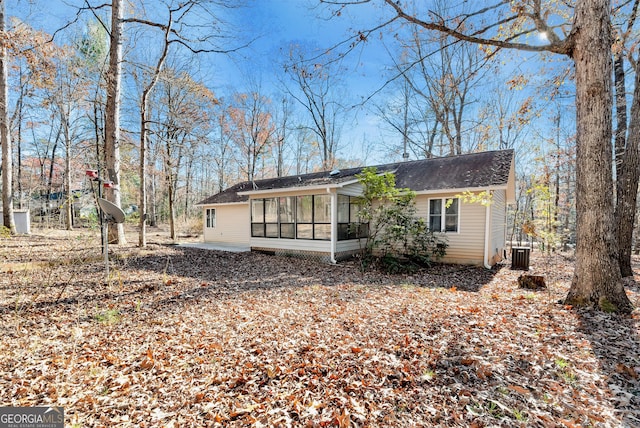 exterior space with cooling unit and a sunroom