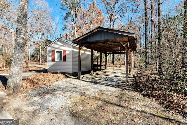 view of side of home with a carport