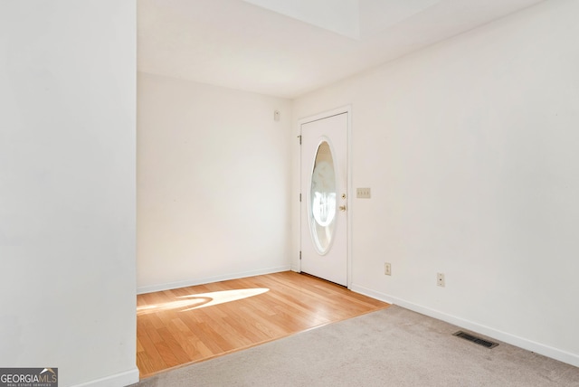 view of carpeted foyer