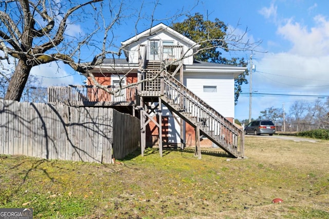 back of property with a lawn