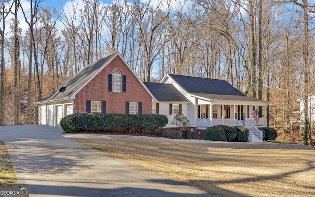 view of front of property with a garage and a porch