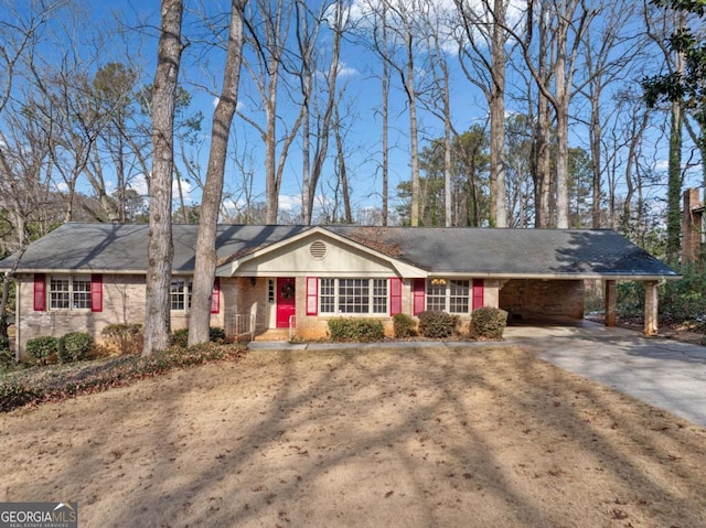 ranch-style home with a front lawn and a carport