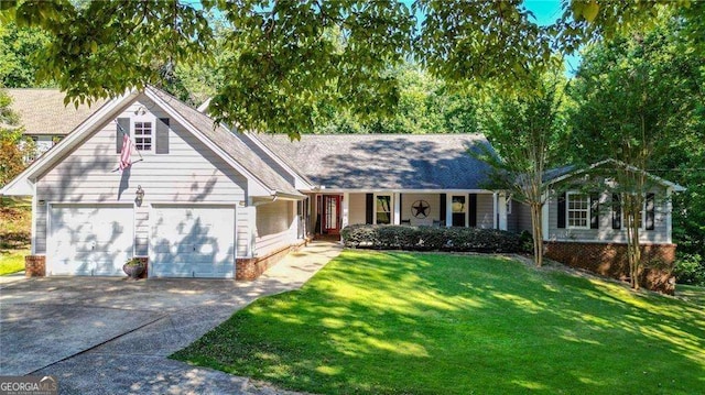 view of front of home with a front yard and a garage