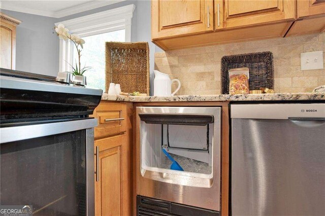 kitchen featuring stainless steel appliances, light stone counters, tasteful backsplash, and crown molding