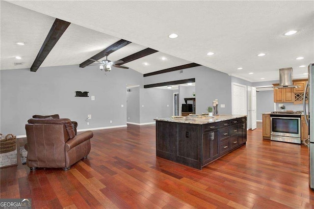 kitchen with vaulted ceiling with beams, an island with sink, dark brown cabinetry, stainless steel range, and island range hood