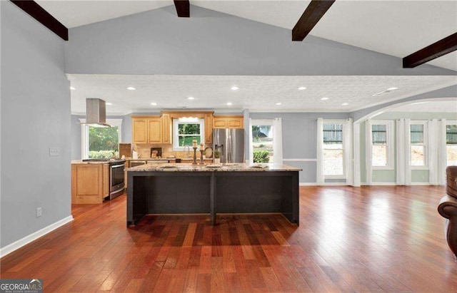 kitchen with island exhaust hood, stainless steel appliances, a center island, light stone countertops, and dark wood-type flooring