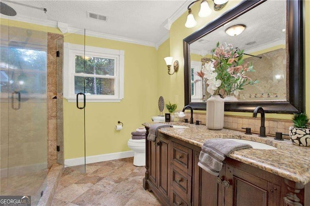 bathroom featuring toilet, a textured ceiling, an enclosed shower, ornamental molding, and vanity