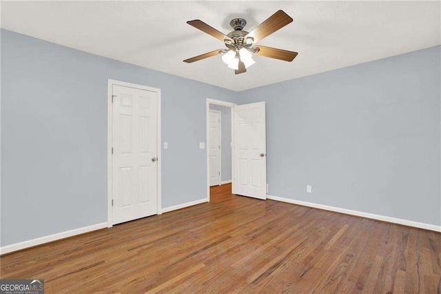 unfurnished bedroom featuring ceiling fan and wood-type flooring