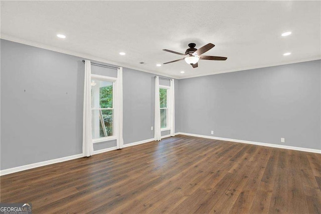 spare room featuring ornamental molding, ceiling fan, and dark hardwood / wood-style flooring