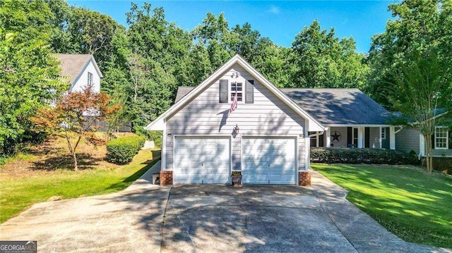 view of front of home featuring a garage and a front yard