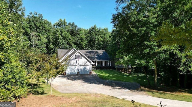 view of front facade with a garage and a front yard