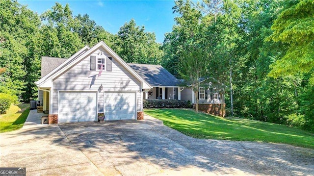 view of front of property featuring a front yard, a garage, and central AC unit