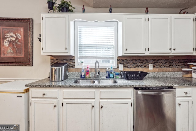 kitchen featuring a textured ceiling, dishwasher, tasteful backsplash, white cabinetry, and sink