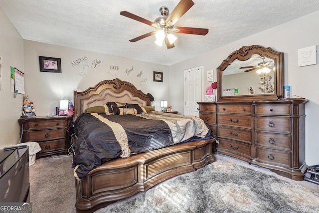 bedroom with a textured ceiling, ceiling fan, and carpet