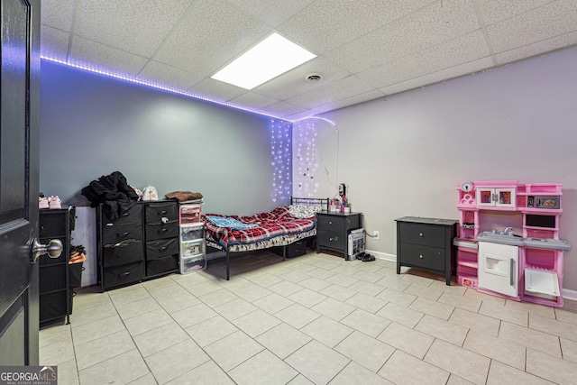 bedroom featuring a paneled ceiling