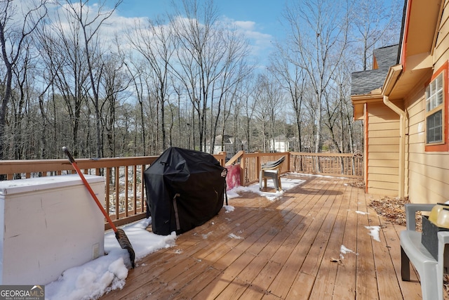 snow covered deck with grilling area