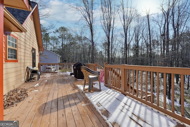 view of snow covered deck