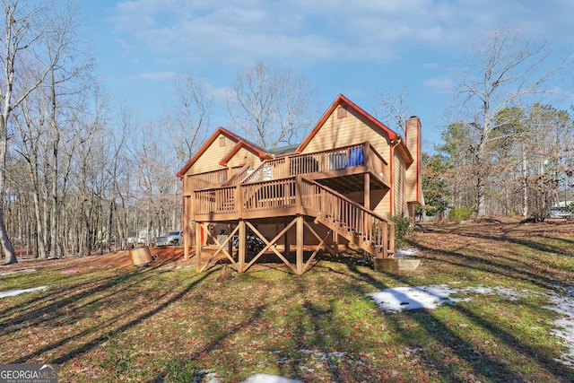 rear view of house with a deck