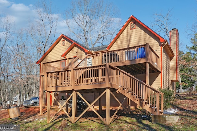 back of house with a wooden deck