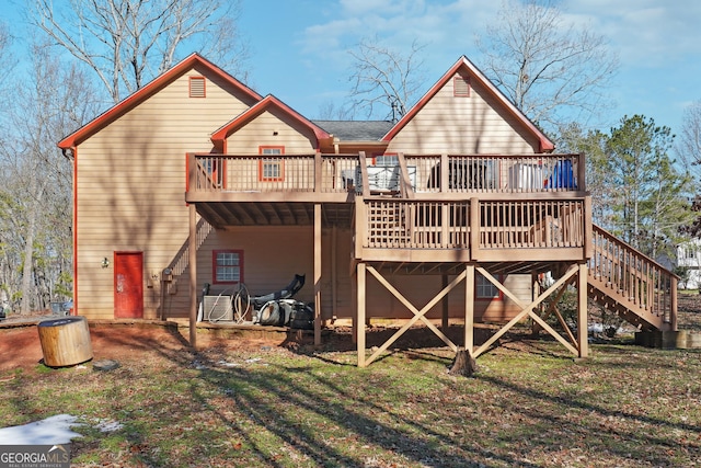 rear view of property featuring a deck