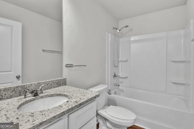 full bathroom with shower / bath combination, vanity, and toilet
