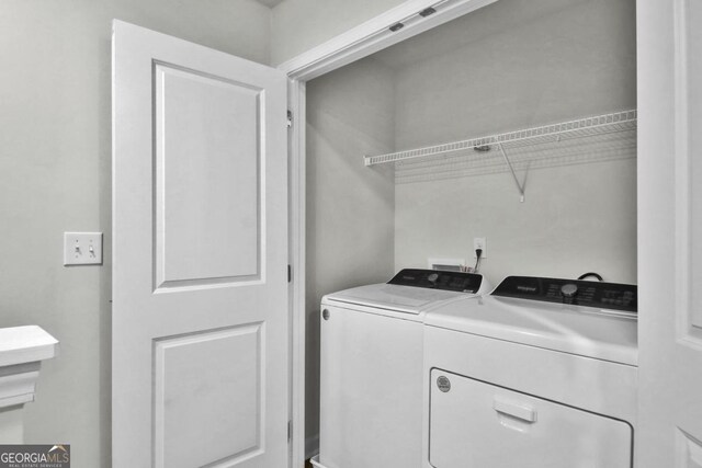washroom with separate washer and dryer