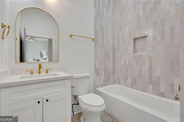 full bathroom featuring shower / bath combination, toilet, ceiling fan, and vanity