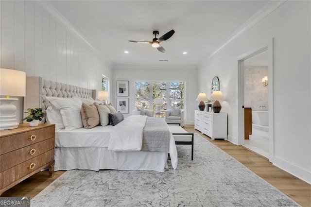 bedroom with ceiling fan, ornamental molding, and hardwood / wood-style floors