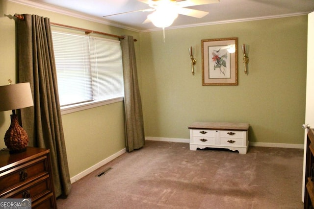 bedroom featuring ornamental molding, ceiling fan, and carpet