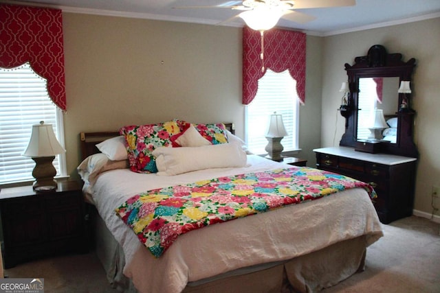 carpeted bedroom with ceiling fan and crown molding