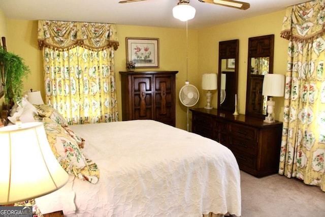 bedroom featuring ceiling fan and light carpet