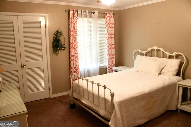 bedroom featuring ornamental molding, a closet, multiple windows, and dark colored carpet