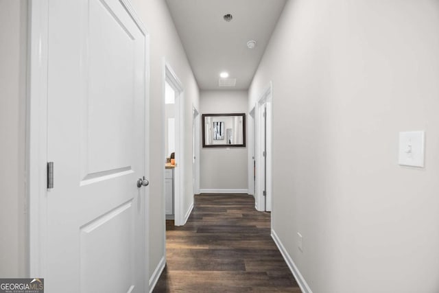 corridor featuring dark wood-type flooring