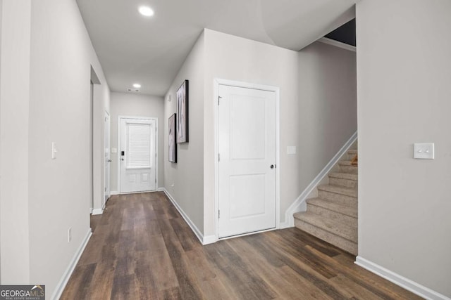 corridor with dark hardwood / wood-style floors