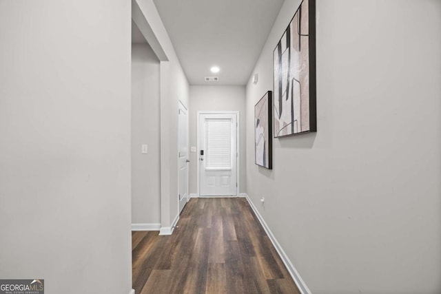 hall with dark wood-type flooring