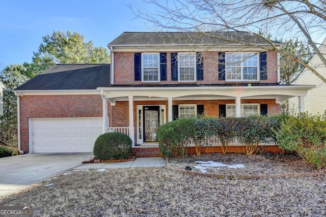 view of front of house with a porch and a garage